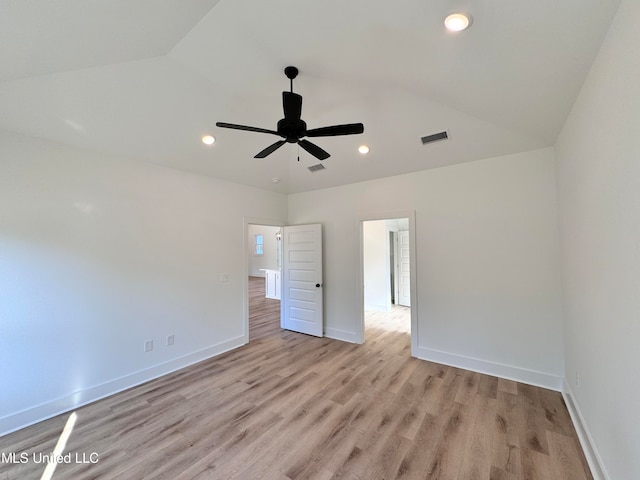 unfurnished bedroom with light hardwood / wood-style flooring, vaulted ceiling, and ceiling fan