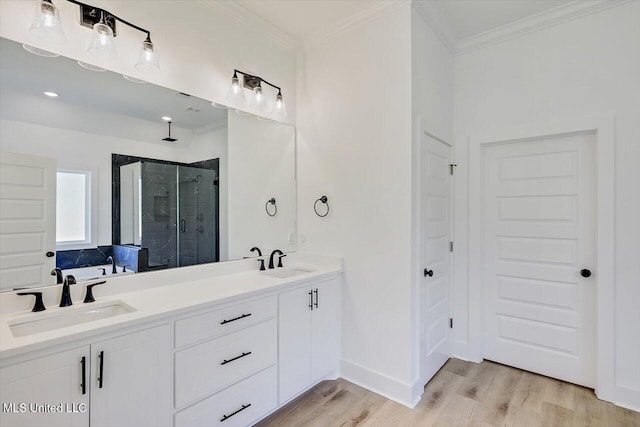 1025 Mullican Rd, Florence, MS 39073 - full bathroom with wood finished floors, crown molding, a sink, and a stall shower