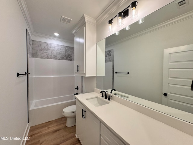 full bathroom featuring toilet, hardwood / wood-style floors, crown molding, vanity, and bathing tub / shower combination