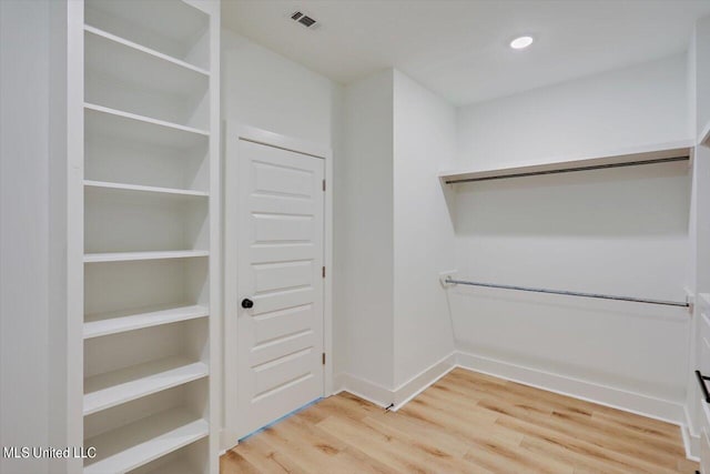 1025 Mullican Rd, Florence, MS 39073 - walk in closet featuring light wood-type flooring and visible vents