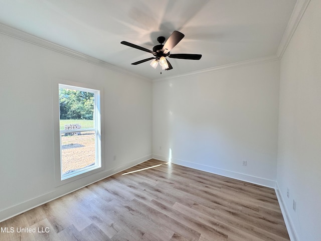 spare room featuring light hardwood / wood-style flooring, ornamental molding, and ceiling fan