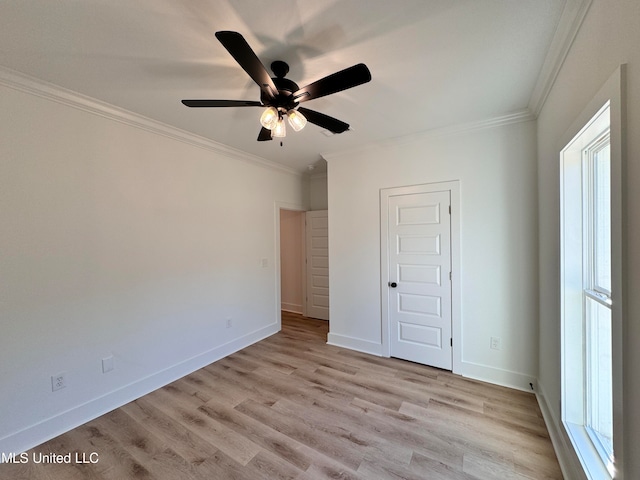 unfurnished bedroom with ceiling fan, ornamental molding, and light hardwood / wood-style floors