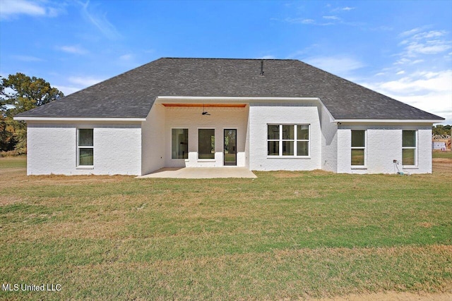 1025 Mullican Rd, Florence, MS 39073 - back of property with a yard, roof with shingles, and a patio area
