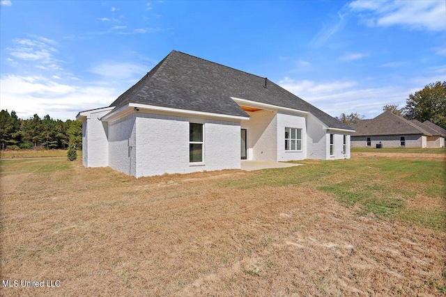 1025 Mullican Rd, Florence, MS 39073 - back of property with a yard and a patio area