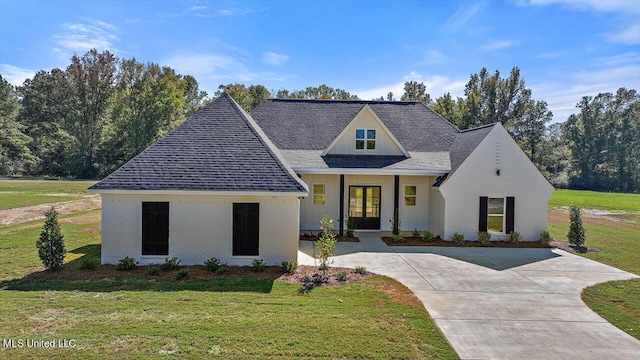 1025 Mullican Rd, Florence, MS 39073 - view of front of property featuring french doors, a shingled roof, and a front lawn