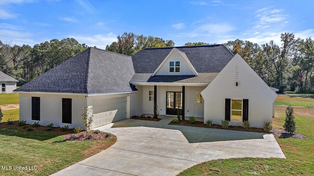 view of front facade with a front lawn and a garage