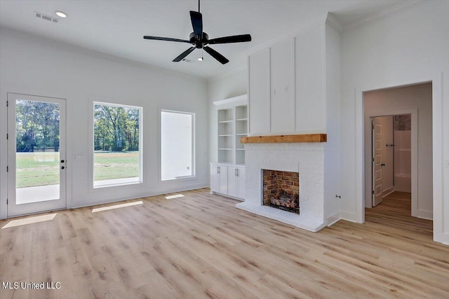 1025 Mullican Rd, Florence, MS 39073 - unfurnished living room with light wood finished floors, a brick fireplace, recessed lighting, visible vents, and ornamental molding