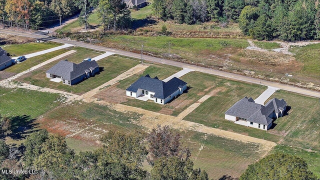 birds eye view of property with a rural view