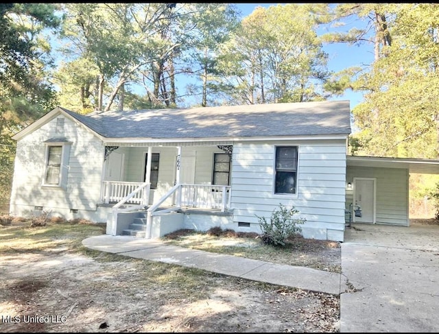 766 Monterey St A-B, Unit A-B Jackson, MS 39204 - ranch-style house with crawl space, covered porch, concrete driveway, a carport, and a shingled roof