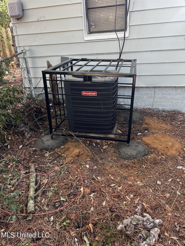 exterior details featuring wood walls and cooling unit