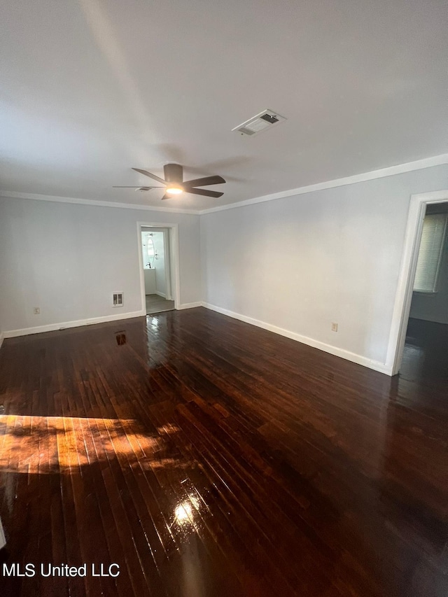 unfurnished room with ceiling fan, ornamental molding, and dark hardwood / wood-style flooring