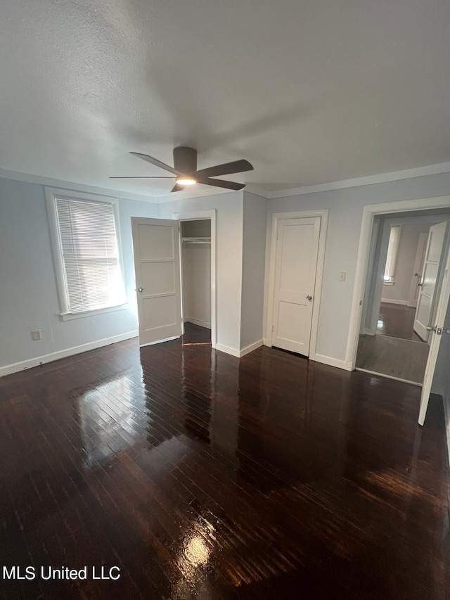 766 Monterey St A-B, Unit A-B Jackson, MS 39204 - unfurnished bedroom featuring baseboards, hardwood / wood-style floors, ornamental molding, a closet, and a ceiling fan