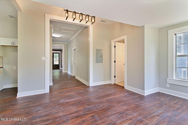 305 First Ave, New Augusta, MS 39462 - spare room featuring dark wood-style floors, electric panel, baseboards, and attic access