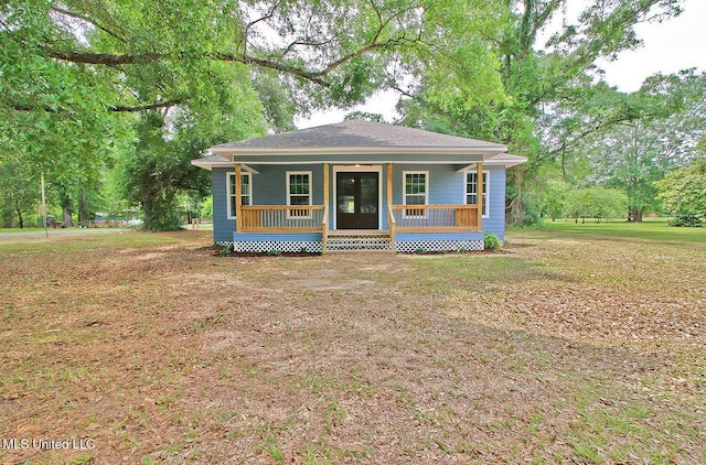 305 First Ave, New Augusta, MS 39462 - view of front of house featuring a porch and a front lawn