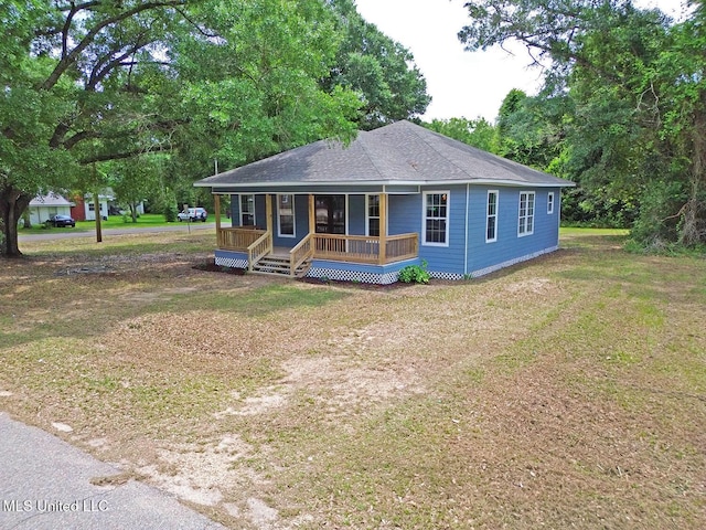 305 First Ave, New Augusta, MS 39462 - view of front of property featuring covered porch, a front lawn, and a shingled roof