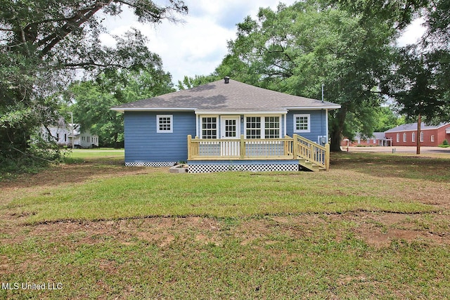 305 First Ave, New Augusta, MS 39462 - rear view of house featuring a deck, a yard, and a shingled roof