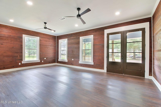 305 First Ave, New Augusta, MS 39462 - unfurnished room with french doors, ceiling fan, wood walls, ornamental molding, and baseboards