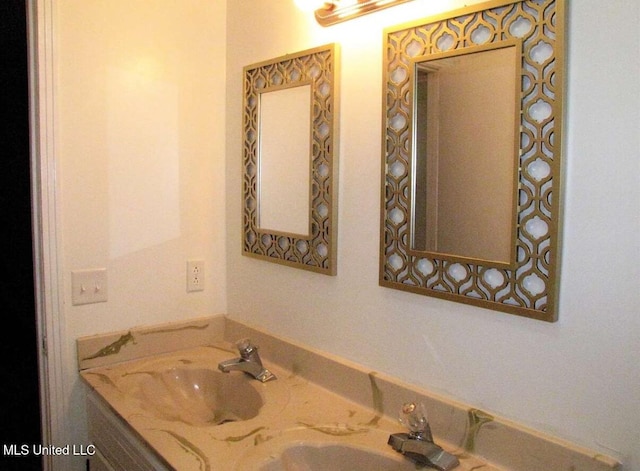 bathroom featuring double vanity