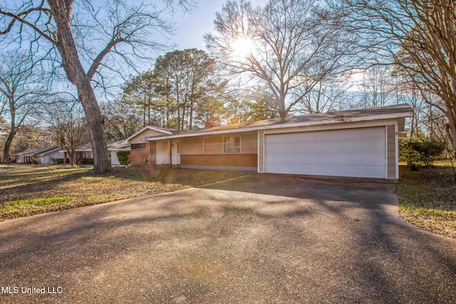 view of front of property featuring an attached garage and driveway