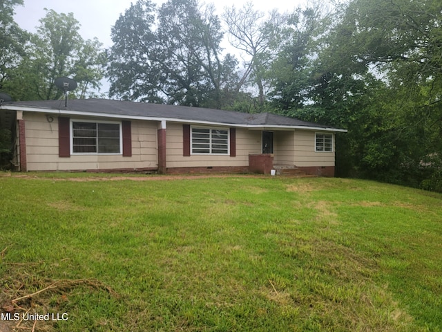 ranch-style home featuring a front lawn