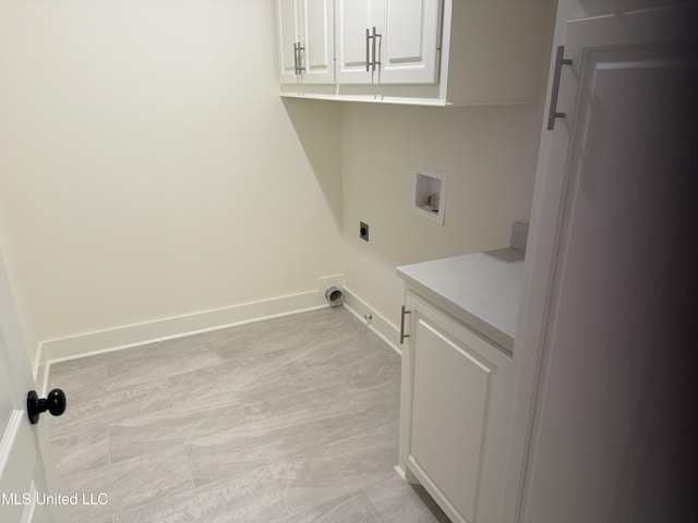 303 Birch Ct Lot 32, Canton, MS 39046 - clothes washing area featuring electric dryer hookup, washer hookup, cabinet space, and baseboards