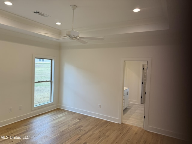 303 Birch Ct Lot 32, Canton, MS 39046 - empty room with light wood finished floors, visible vents, ceiling fan, and baseboards