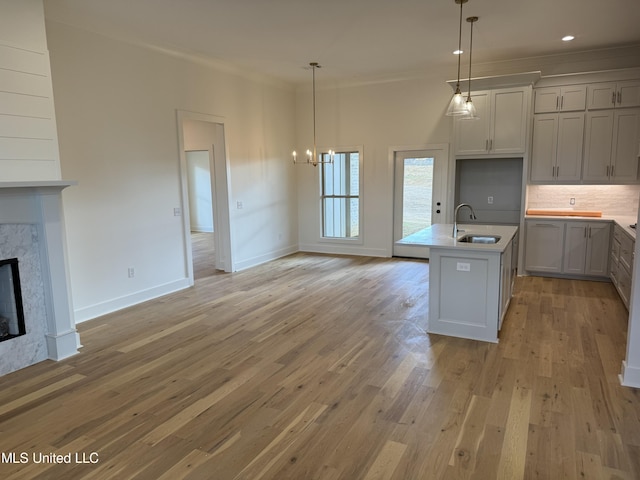 303 Birch Ct Lot 32, Canton, MS 39046 - kitchen with tasteful backsplash, open floor plan, light countertops, and a sink
