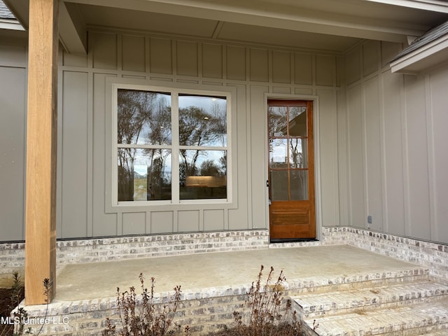 303 Birch Ct Lot 32, Canton, MS 39046 - view of exterior entry featuring board and batten siding