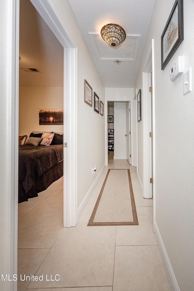 hall with light tile patterned flooring