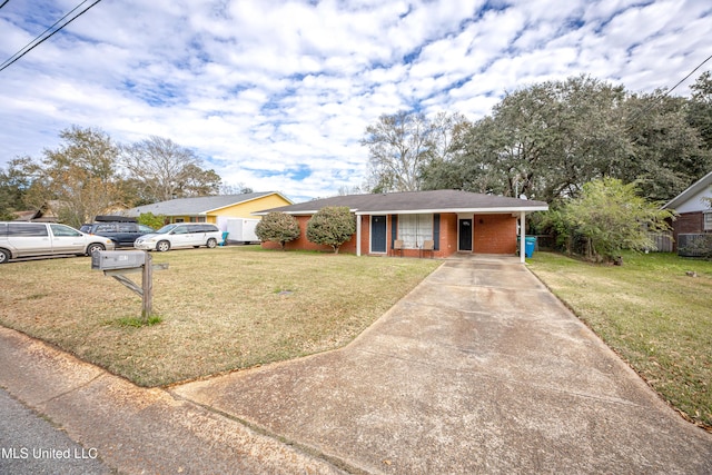 single story home with a front yard and a carport