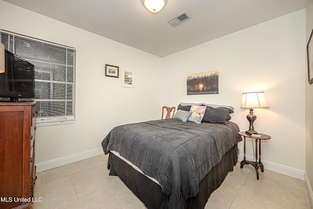 bedroom featuring light tile patterned floors