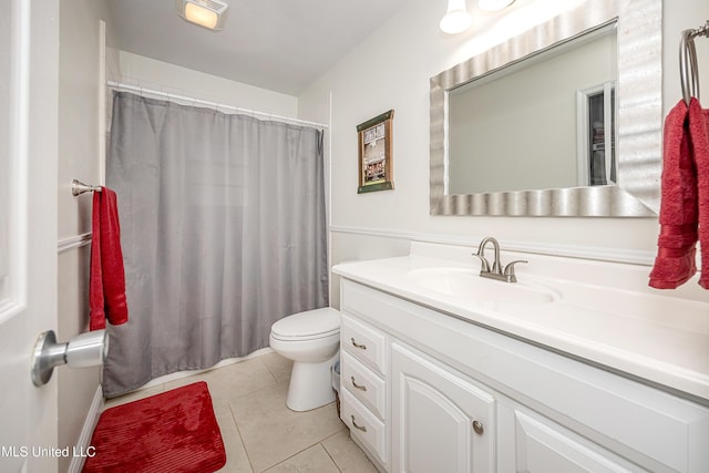 bathroom with walk in shower, tile patterned floors, toilet, and vanity