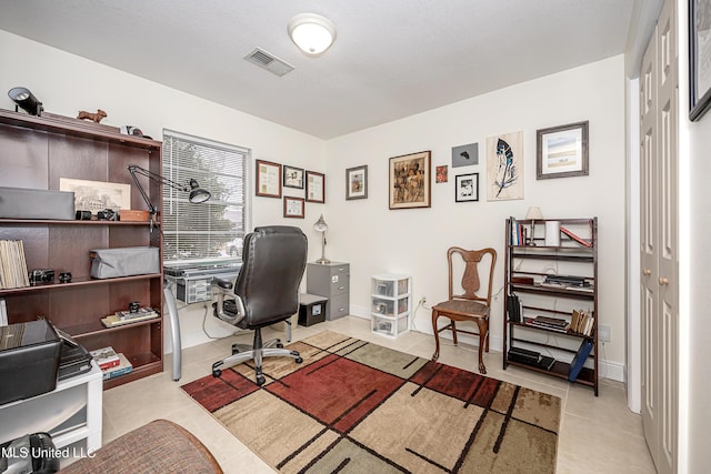 office area with light tile patterned floors