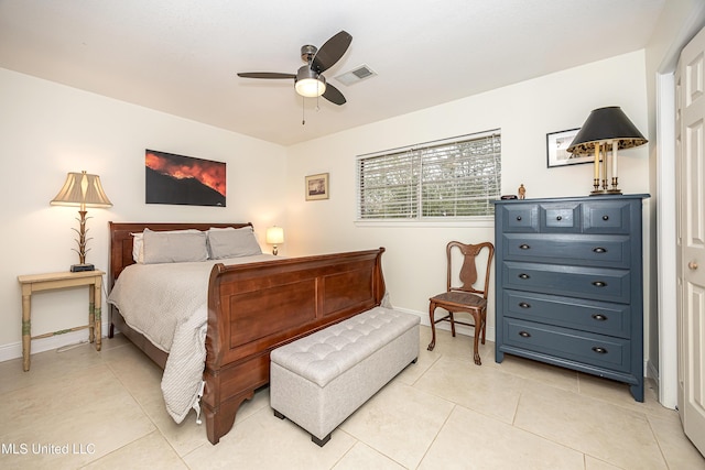 tiled bedroom with ceiling fan