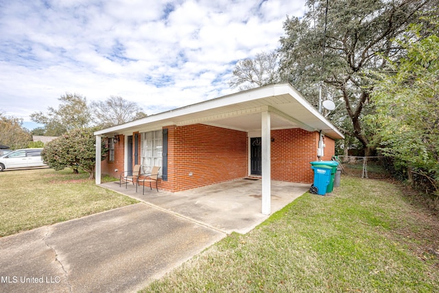 view of property exterior with a carport and a lawn