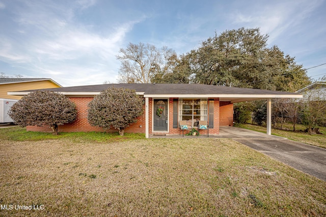 single story home with a front lawn, a carport, and covered porch