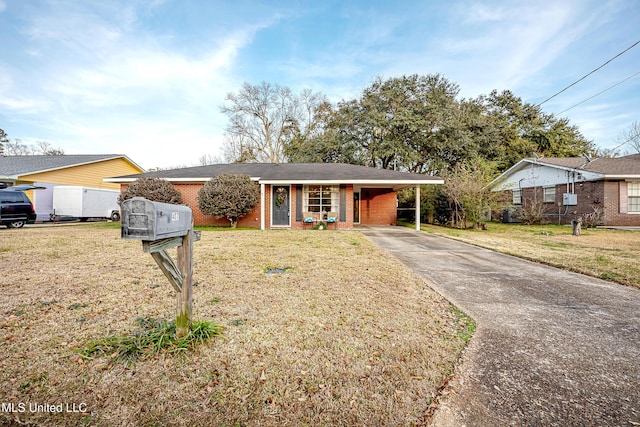 single story home featuring a front lawn and a carport