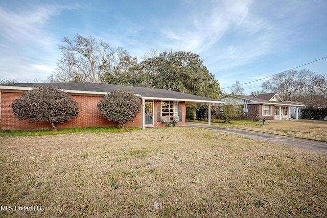 ranch-style house with a carport and a front lawn