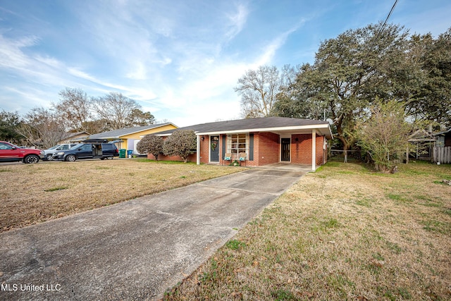 ranch-style home featuring a carport and a front yard