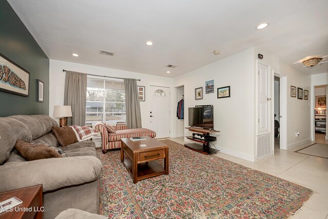 living room with light tile patterned floors