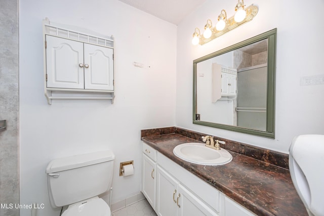 bathroom featuring toilet and vanity