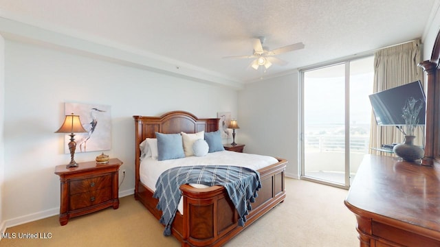 2060 Beach Blvd Unit 701, Biloxi, MS 39531 - bedroom with access to exterior, light carpet, floor to ceiling windows, baseboards, and a ceiling fan