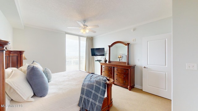 2060 Beach Blvd Unit 701, Biloxi, MS 39531 - bedroom with light colored carpet, a ceiling fan, baseboards, ornamental molding, and expansive windows