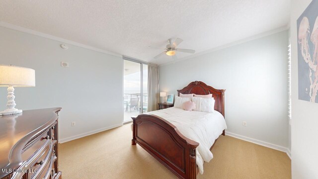2060 Beach Blvd Unit 701, Biloxi, MS 39531 - bedroom featuring light carpet, baseboards, ceiling fan, a textured ceiling, and crown molding