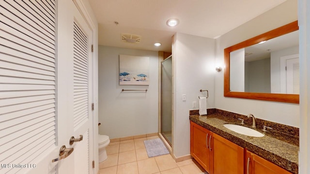 2060 Beach Blvd Unit 701, Biloxi, MS 39531 - bathroom featuring a closet, vanity, toilet, a stall shower, and recessed lighting