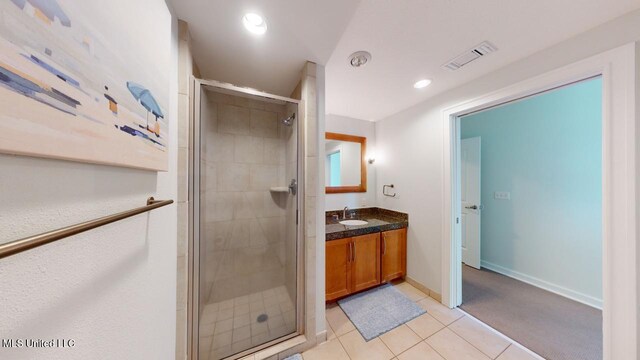 2060 Beach Blvd Unit 701, Biloxi, MS 39531 - bathroom featuring vanity, a shower stall, baseboards, tile patterned floors, and recessed lighting