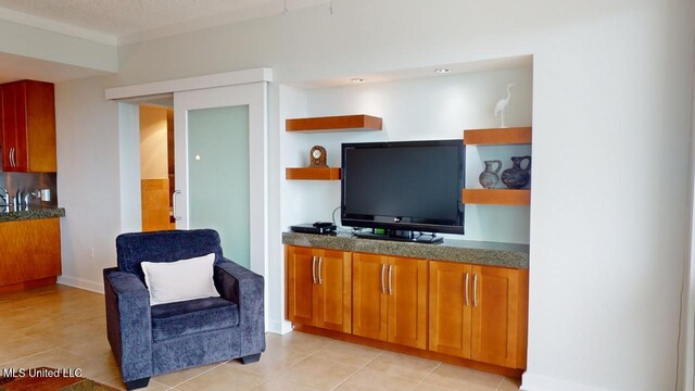 2060 Beach Blvd Unit 701, Biloxi, MS 39531 - living room with light tile patterned floors and baseboards