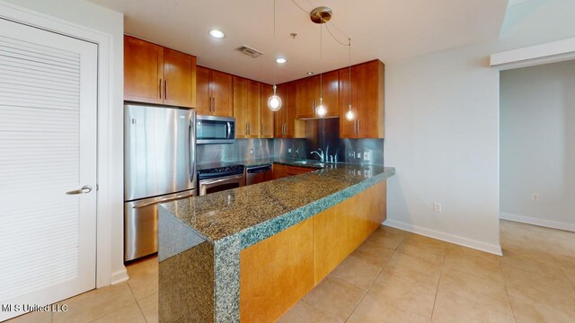 2060 Beach Blvd Unit 701, Biloxi, MS 39531 - kitchen with stainless steel appliances, a peninsula, decorative backsplash, light tile patterned floors, and recessed lighting
