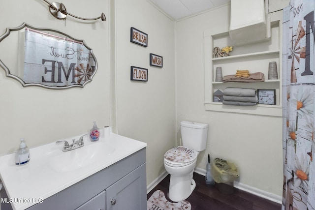1264 28th St, Gulfport, MS 39501 - full bath with vanity, toilet, wood finished floors, and baseboards