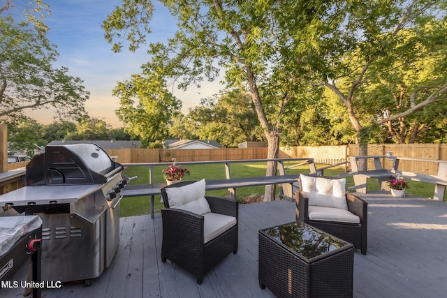 1264 28th St, Gulfport, MS 39501 - patio terrace at dusk featuring a deck and an outdoor hangout area